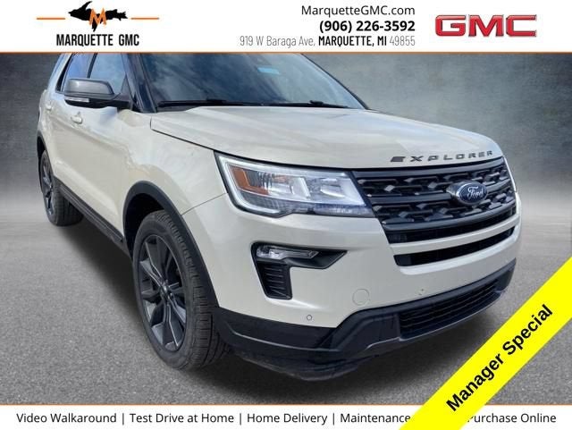 2018 Ford Explorer XLT in Beige — front three-quarter view